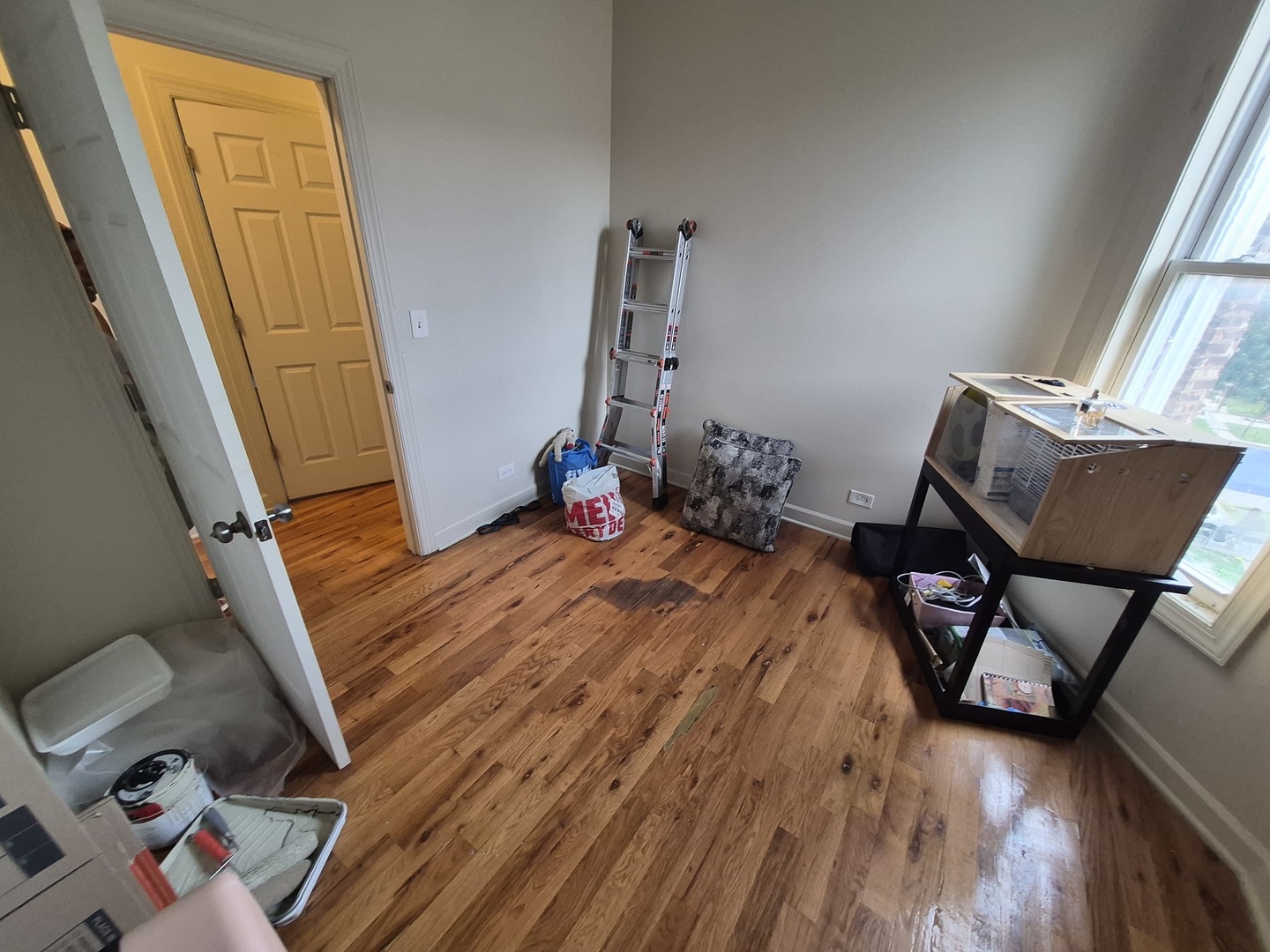 4126 West Adams Street Chicago, IL 60624 - Photo 9 of 19 a bed sitting in a bedroom next to a window