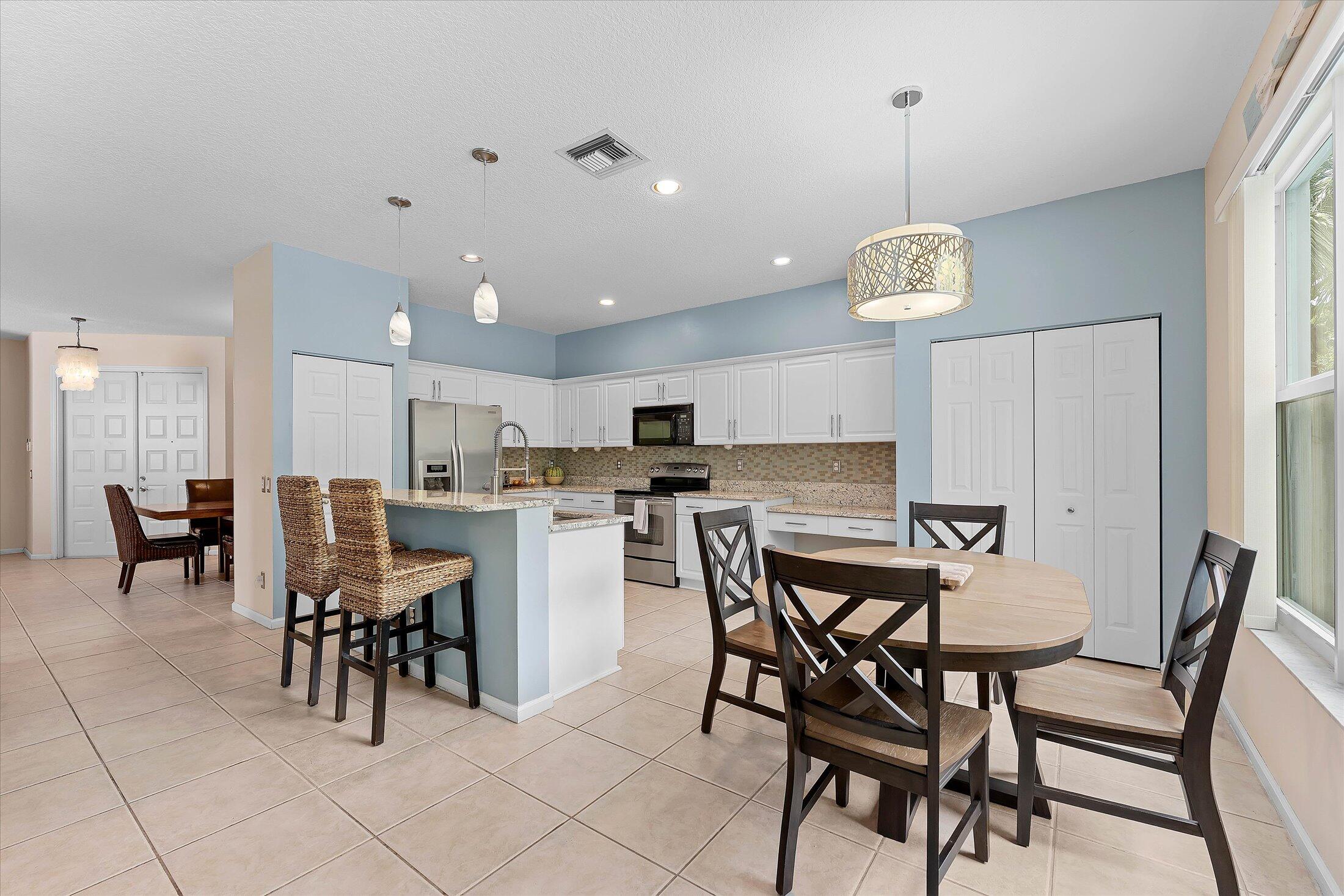 7061 Chesapeake Circle Boynton Beach, FL 33436 - Photo 12 of 51 a view of a dining area with furniture