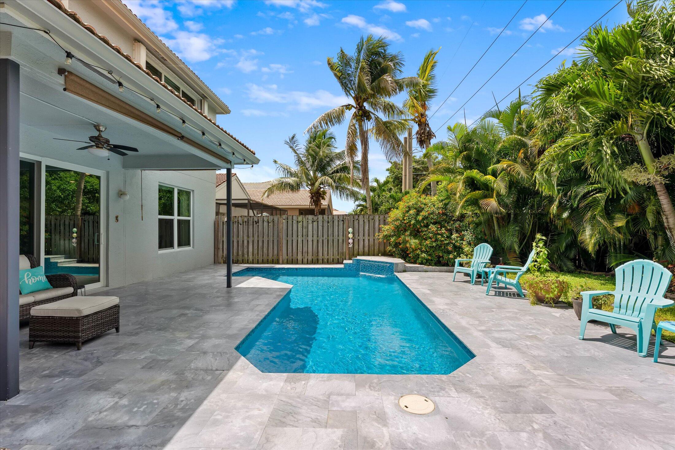 7061 Chesapeake Circle Boynton Beach, FL 33436 - Photo 19 of 51 a view of a backyard with swimming pool