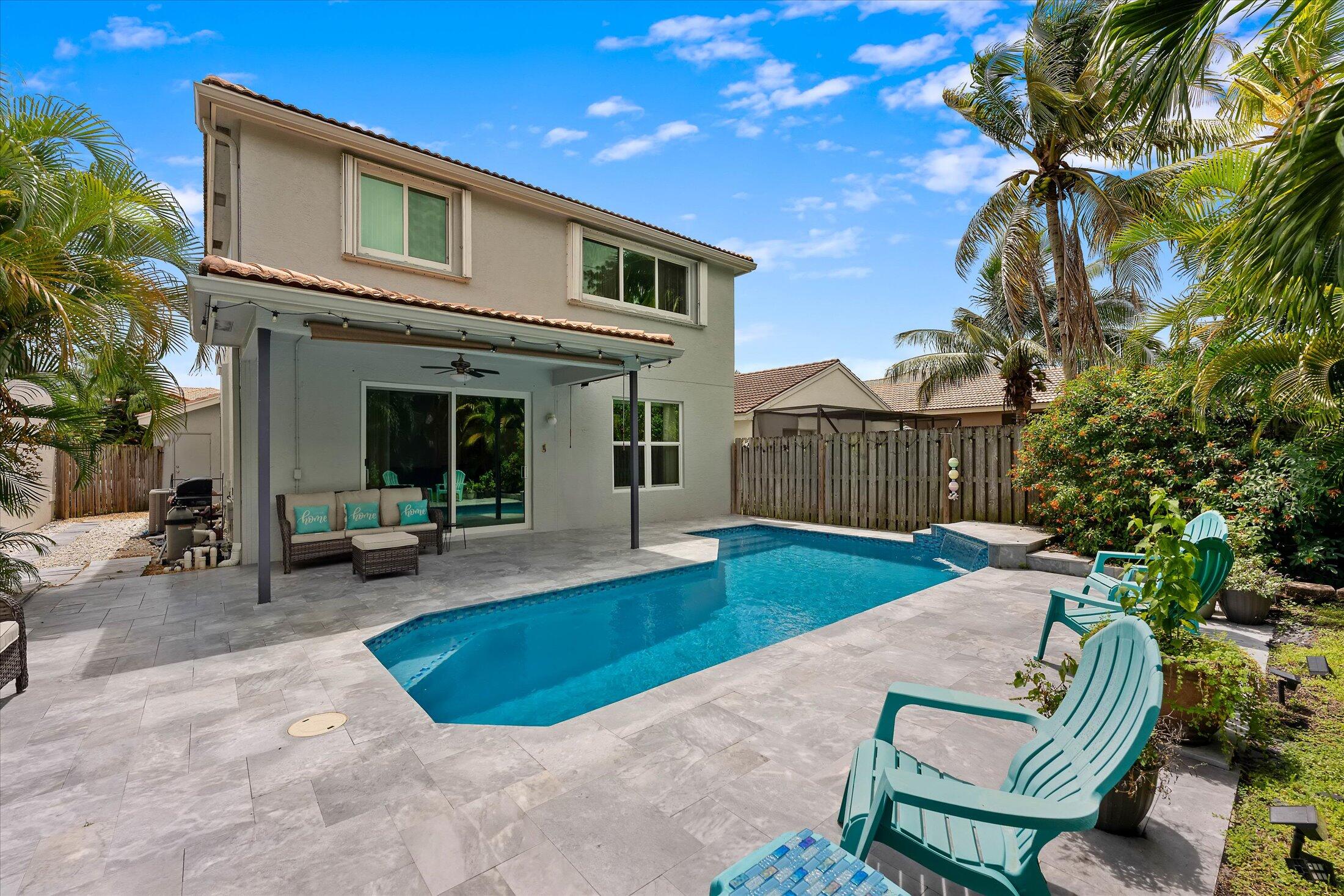 7061 Chesapeake Circle Boynton Beach, FL 33436 - Photo 20 of 51 a view of a house with backyard and sitting area