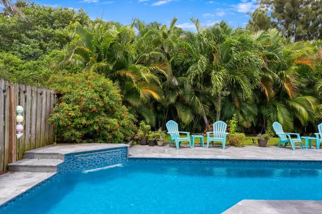 a view of swimming pool with a patio