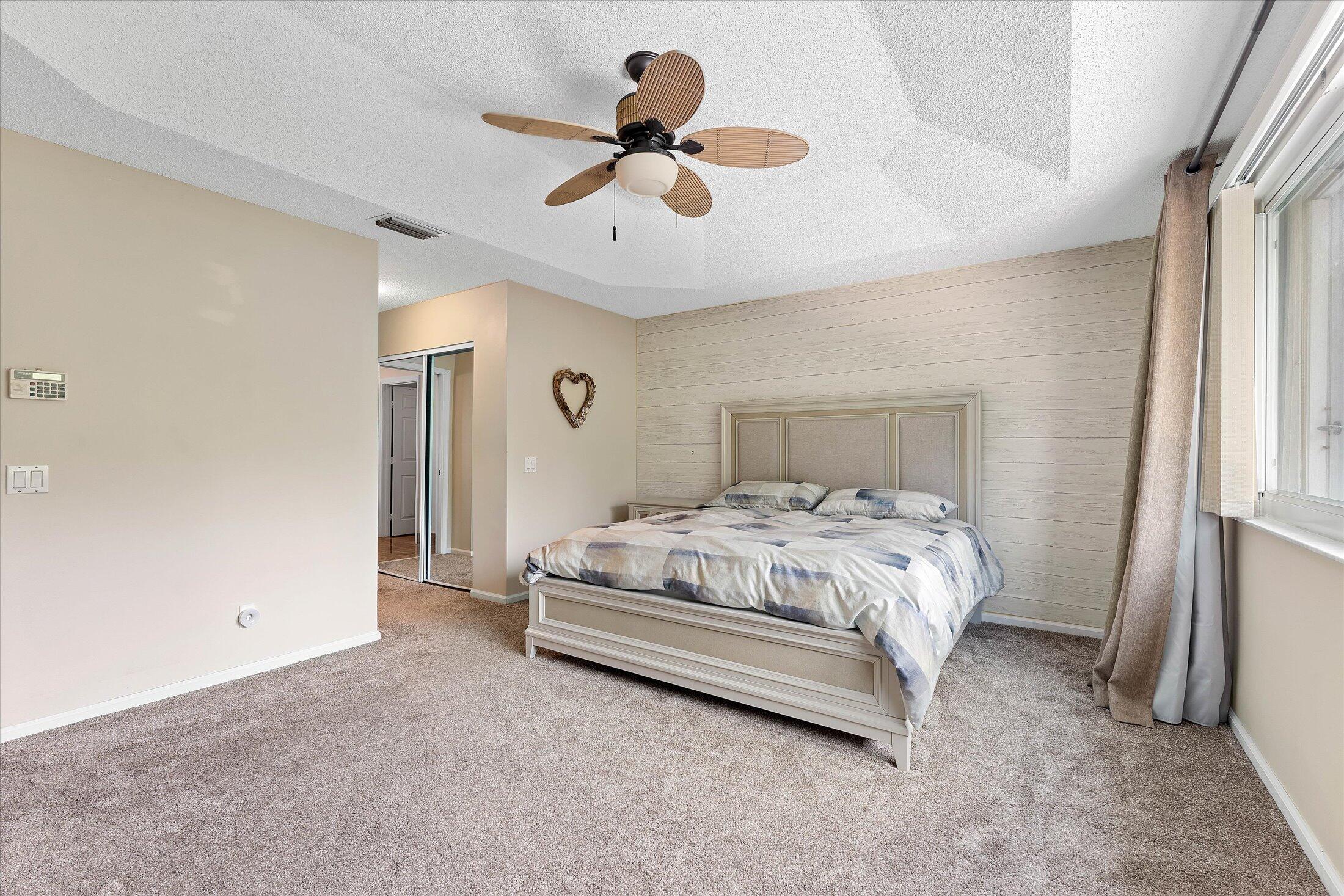 7061 Chesapeake Circle Boynton Beach, FL 33436 - Photo 25 of 51 a bedroom with a bed and window