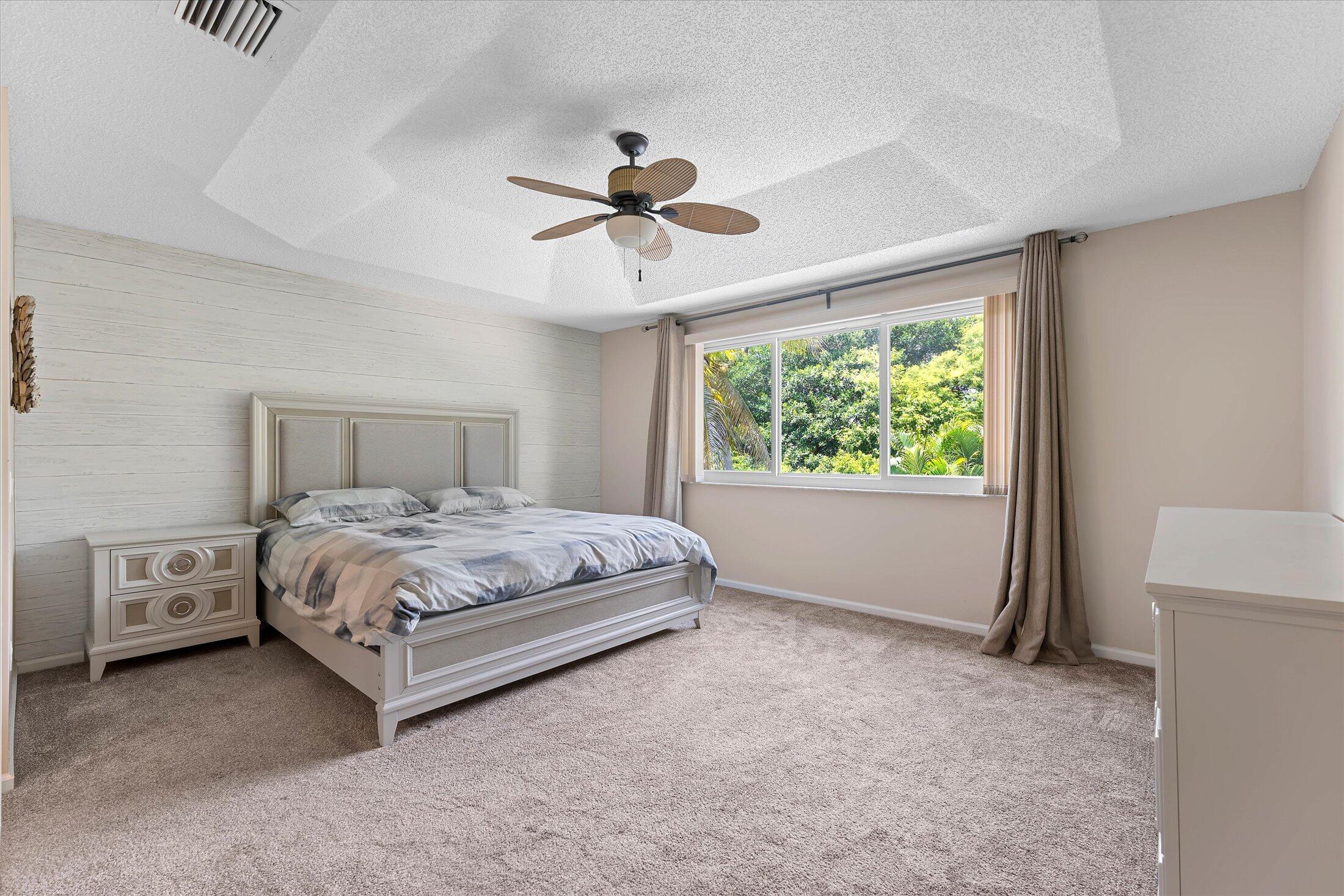 7061 Chesapeake Circle Boynton Beach, FL 33436 - Photo 27 of 51 a bedroom with a bed and a window