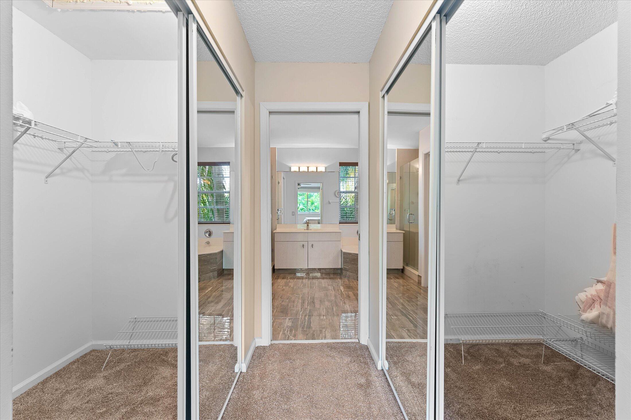 7061 Chesapeake Circle Boynton Beach, FL 33436 - Photo 28 of 51 a bathroom with a glass shower door