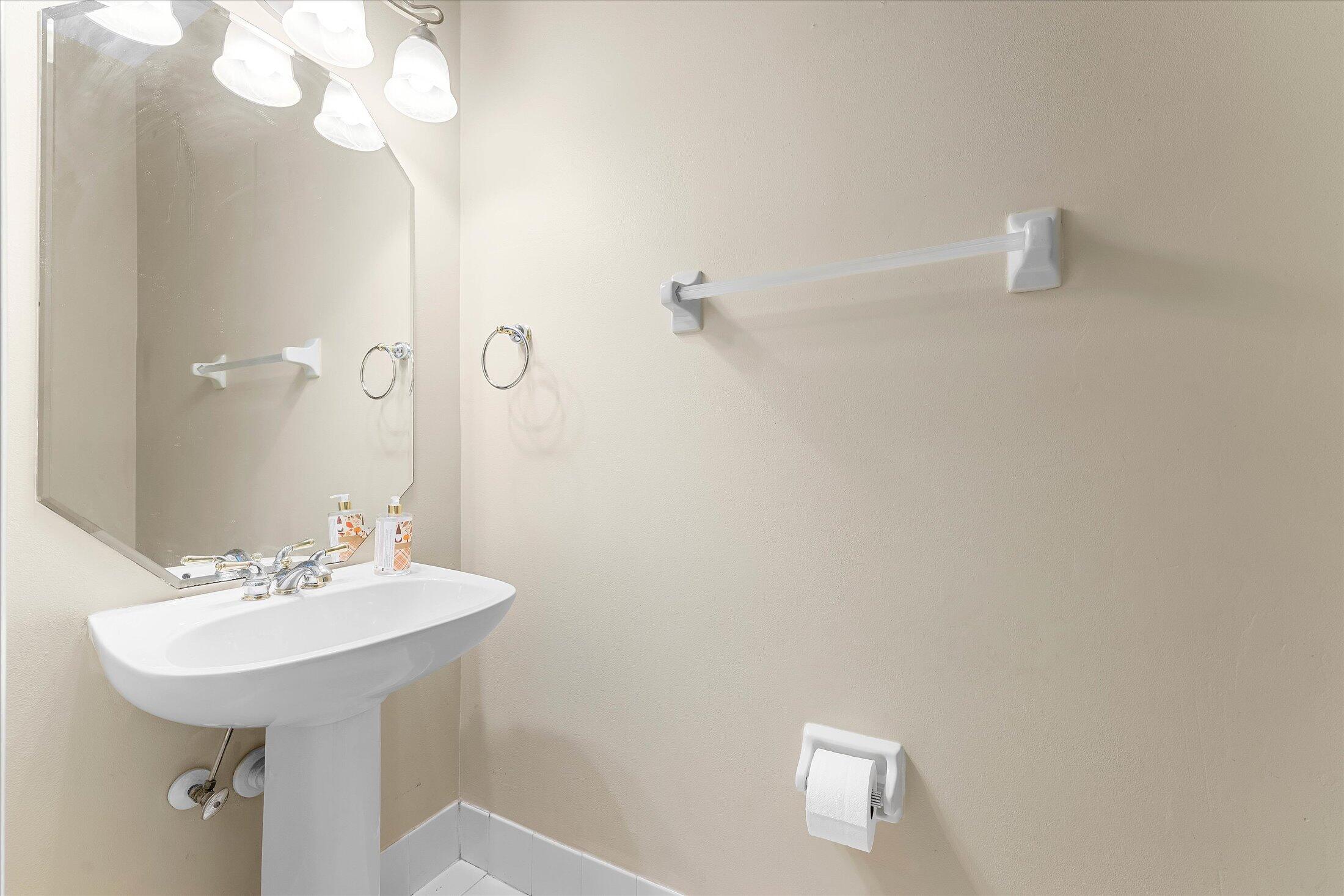 7061 Chesapeake Circle Boynton Beach, FL 33436 - Photo 38 of 51 a bathroom with a sink a mirror and a shower