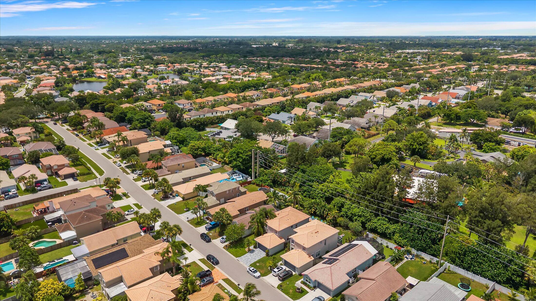 7061 Chesapeake Circle Boynton Beach, FL 33436 - Photo 44 of 51 an aerial view of residential houses with outdoor space