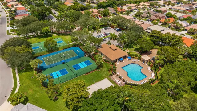 an aerial view of a house with a swimming pool