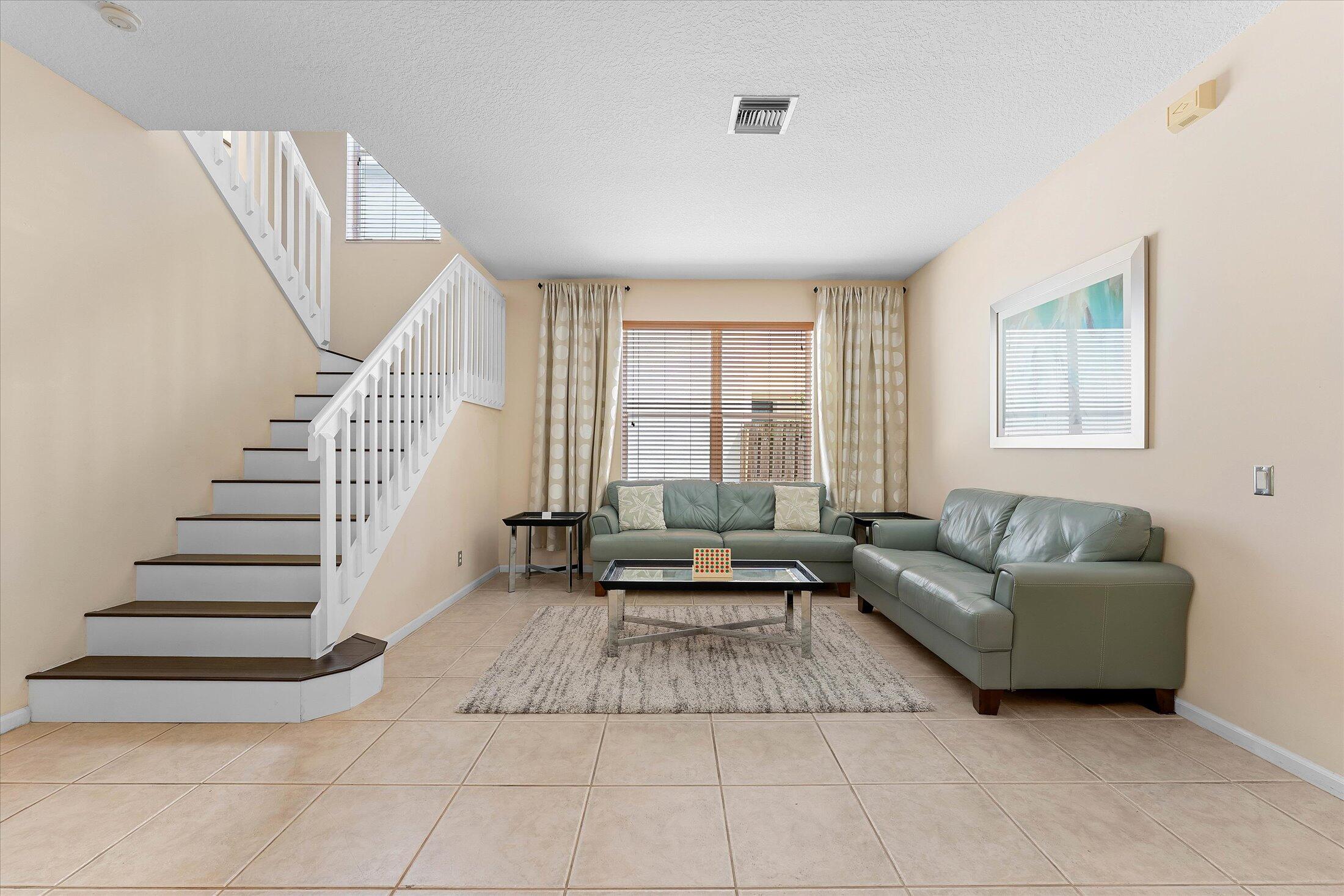 7061 Chesapeake Circle Boynton Beach, FL 33436 - Photo 6 of 51 a living room with furniture and a large window