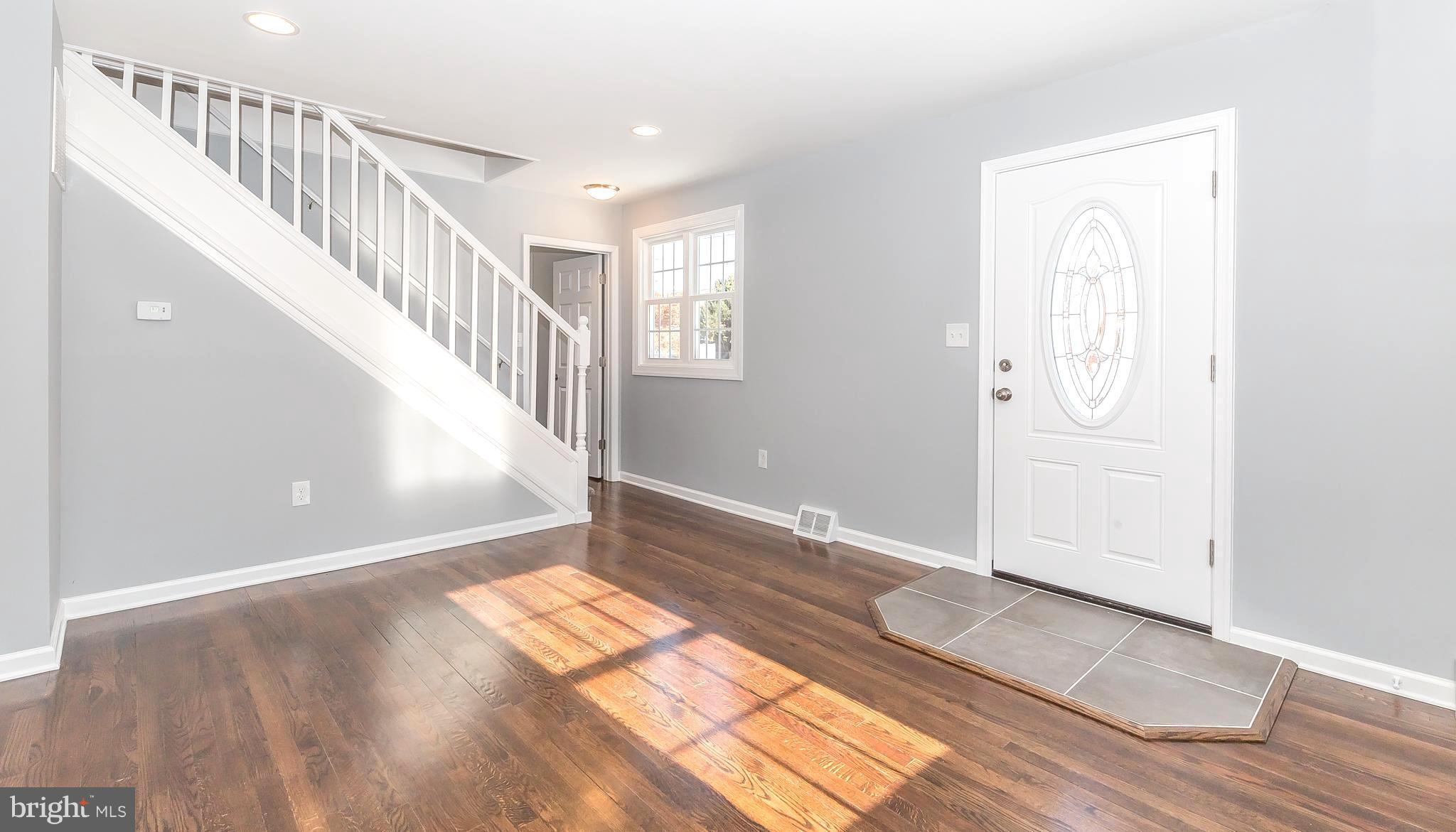 1718 Lynch Road Baltimore, MD 21222 - Photo 6 of 30 BRAND NEW DOOR OPENS TO STUNNING HARDWOOD FLOORS!