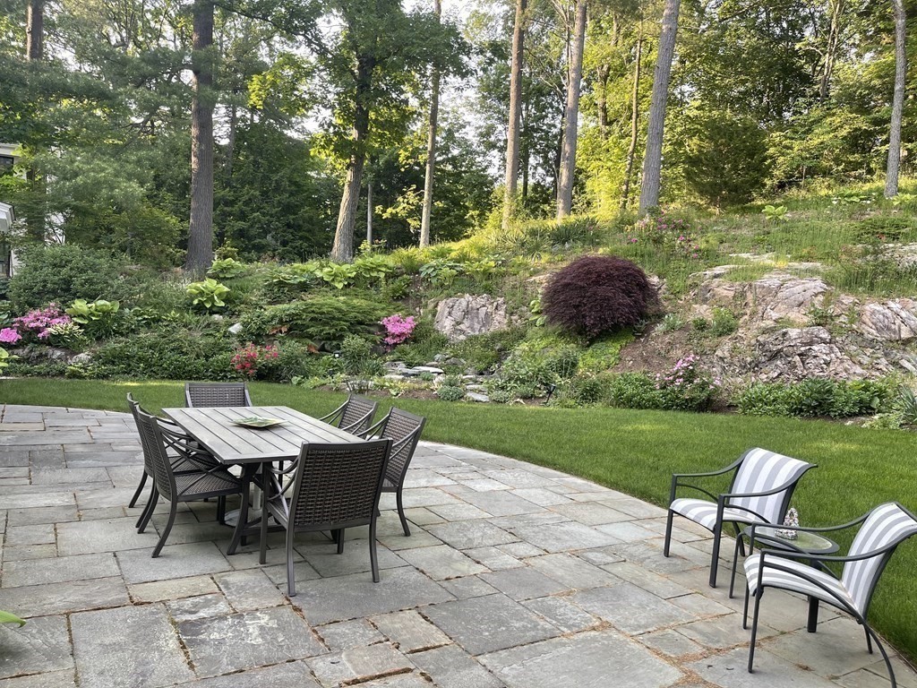 66 Audubon Road Wellesley, MA 02481 - Photo 3 of 22 a view of a backyard with furniture and garden