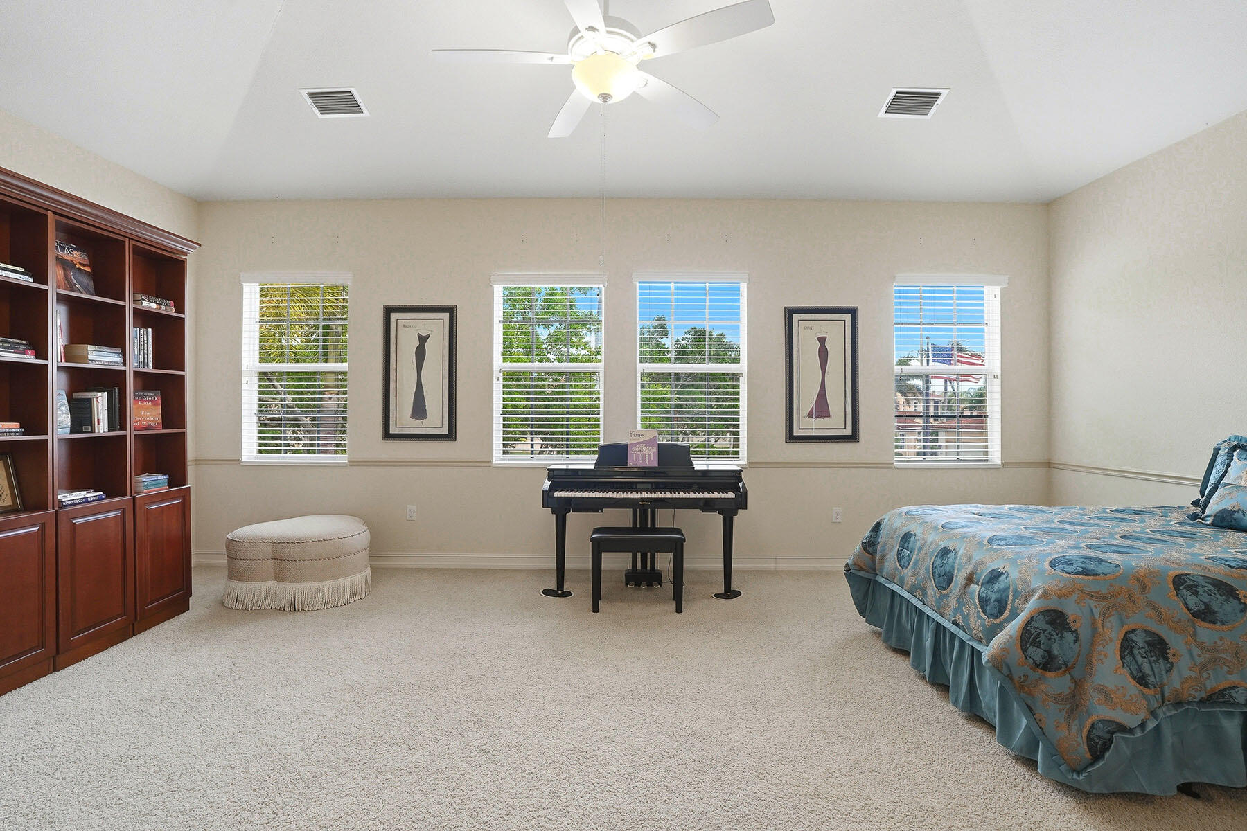 8605 Champions Point, Unit 103 Naples, FL 34113 - Photo 32 of 44 a bedroom with a bed and a couch