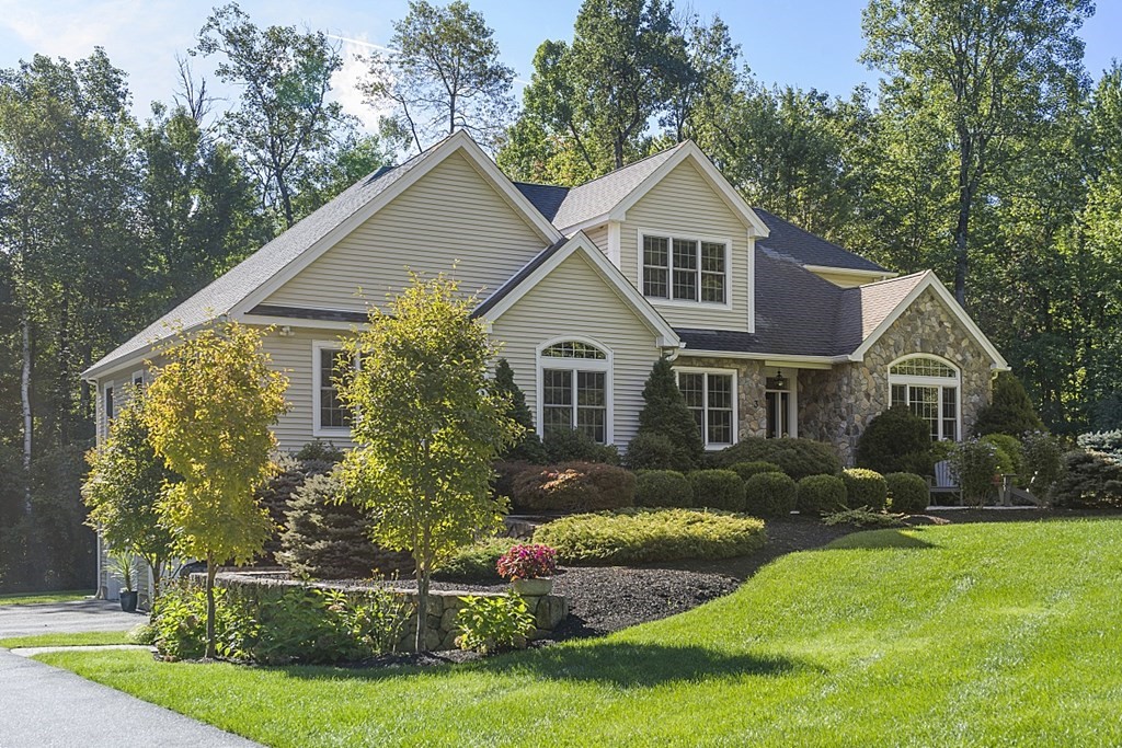 3 Squareshire Road Sterling, MA 01564 - Photo 1 of 42 a front view of a house with a yard and trees