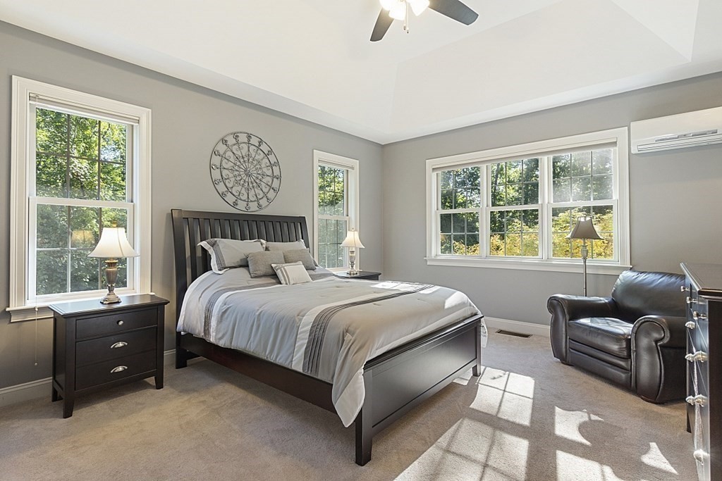 3 Squareshire Road Sterling, MA 01564 - Photo 23 of 42 a bedroom with a bed and a couch