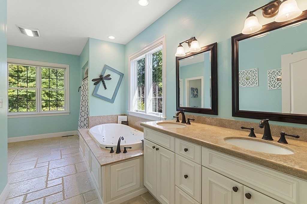 3 Squareshire Road Sterling, MA 01564 - Photo 25 of 42 a bathroom with a tub sink and mirror