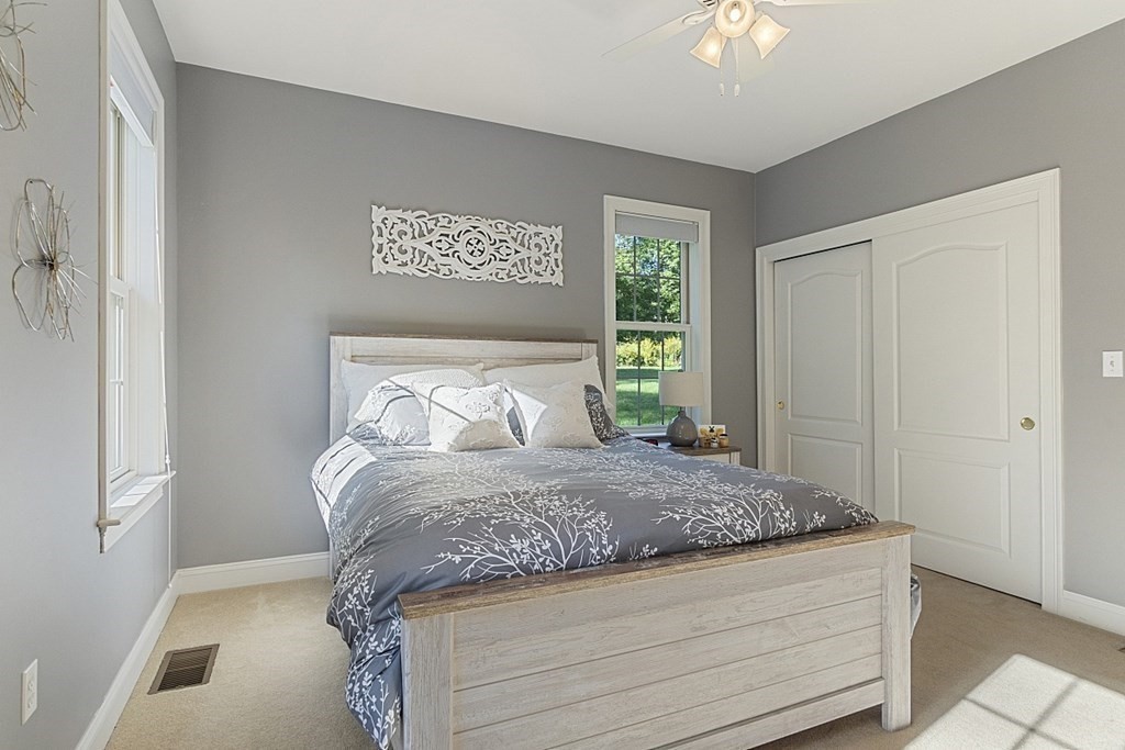 3 Squareshire Road Sterling, MA 01564 - Photo 28 of 42 a bed sitting in a bedroom next to a window
