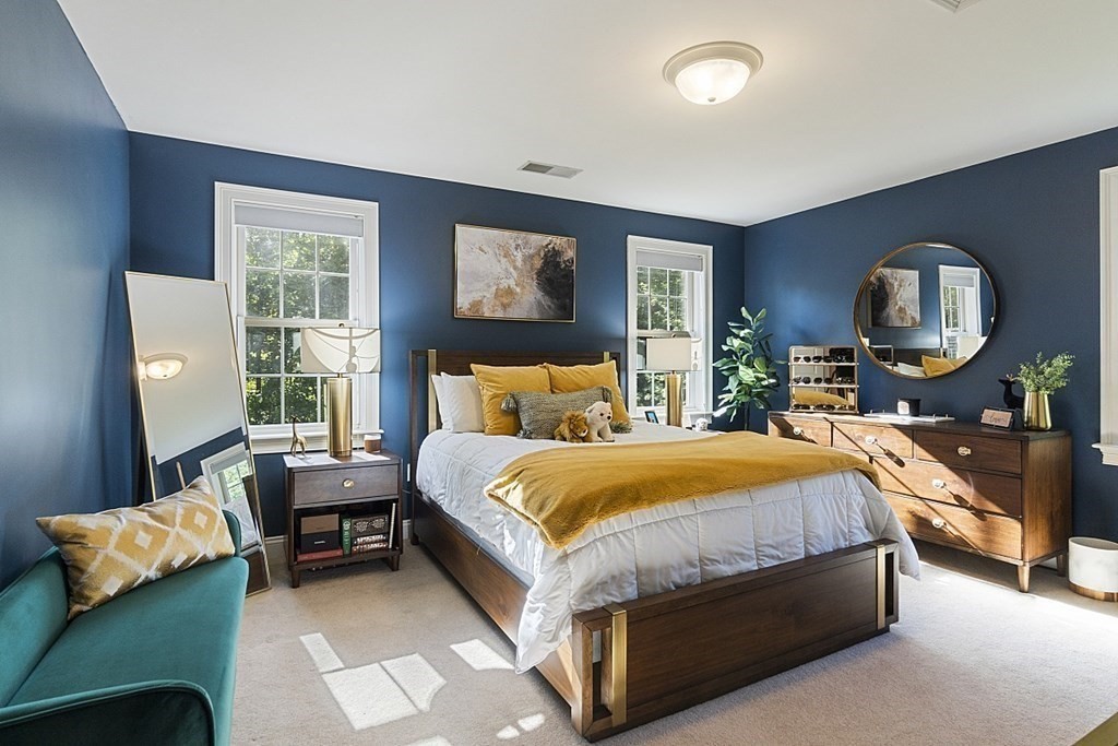 3 Squareshire Road Sterling, MA 01564 - Photo 32 of 42 a bedroom with a bed a mirror on dresser and a large window
