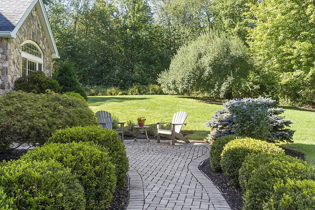 3 Squareshire Road Sterling, MA 01564 - Photo 4 of 42 a view of a swimming pool with lawn chairs under an umbrella