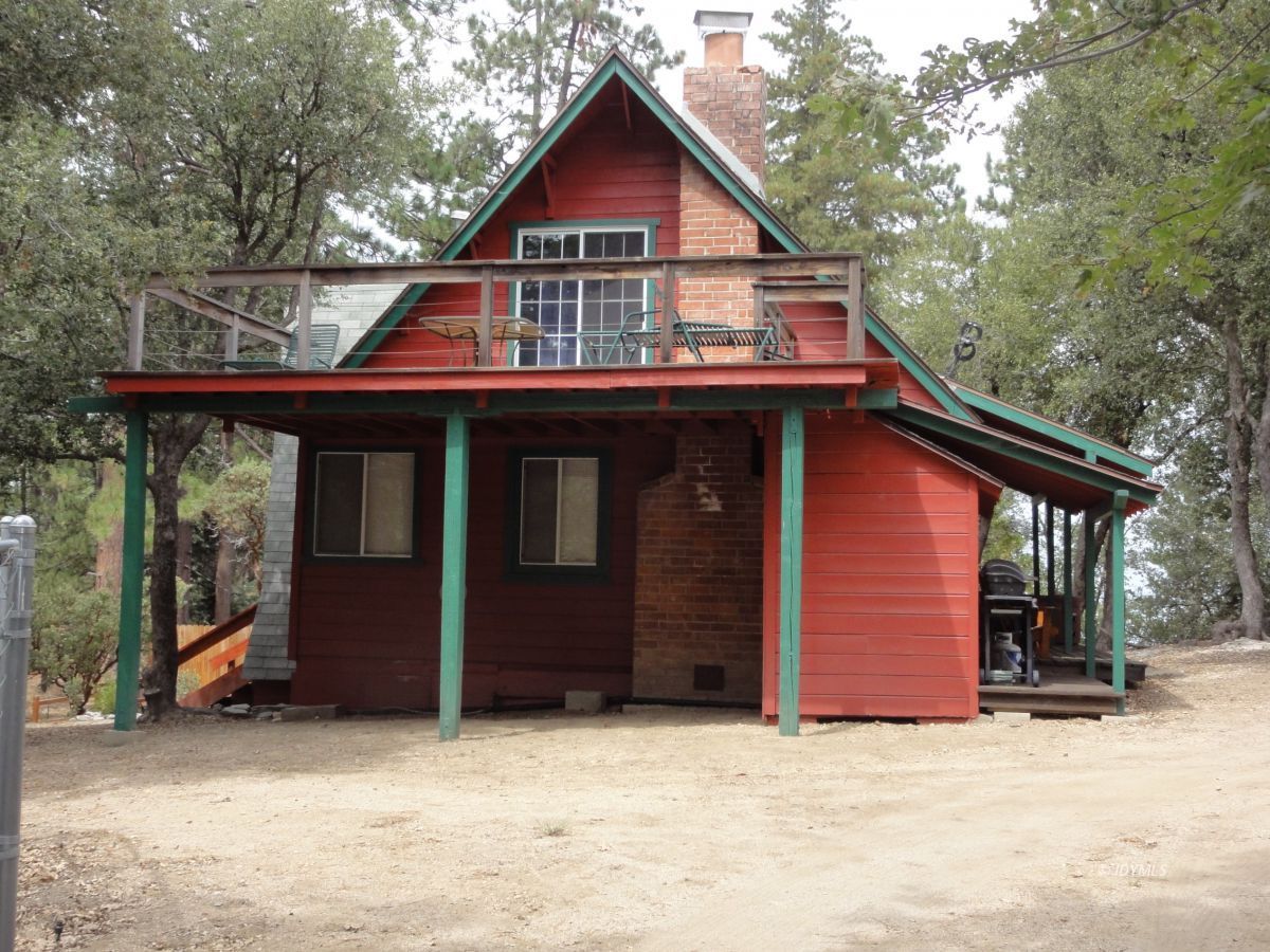 24810 Old Banning Road Idyllwild, CA 92549 - Photo 1 of 22 a view of a house with a balcony and trees