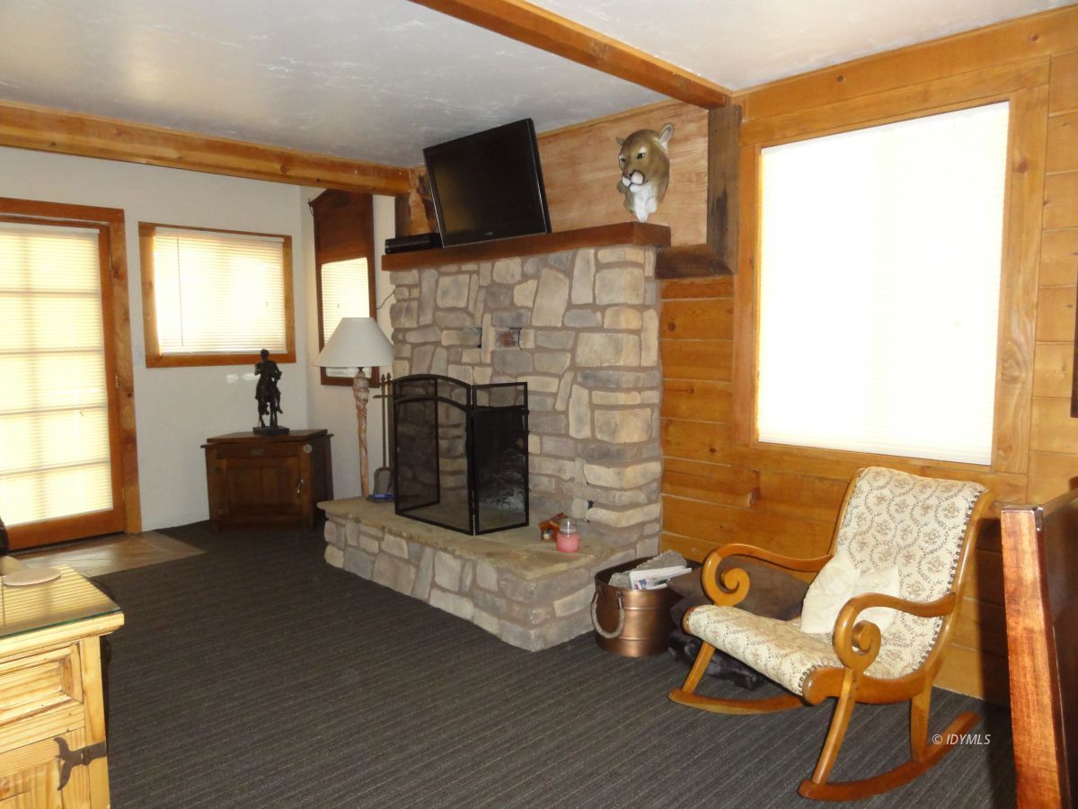 24810 Old Banning Road Idyllwild, CA 92549 - Photo 12 of 22 a living room with furniture and a fireplace
