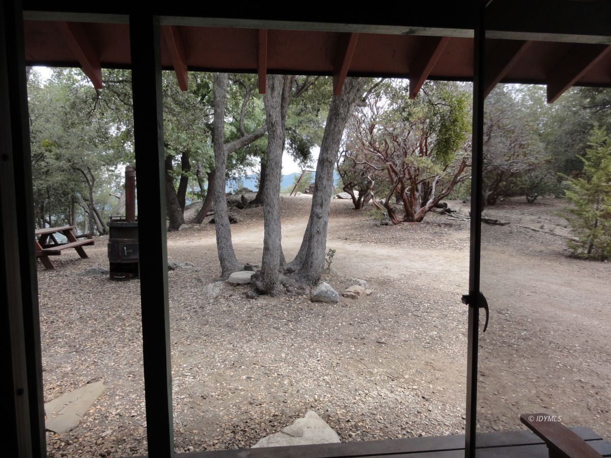 24810 Old Banning Road Idyllwild, CA 92549 - Photo 22 of 22 a view of a floor to ceiling window next to a yard