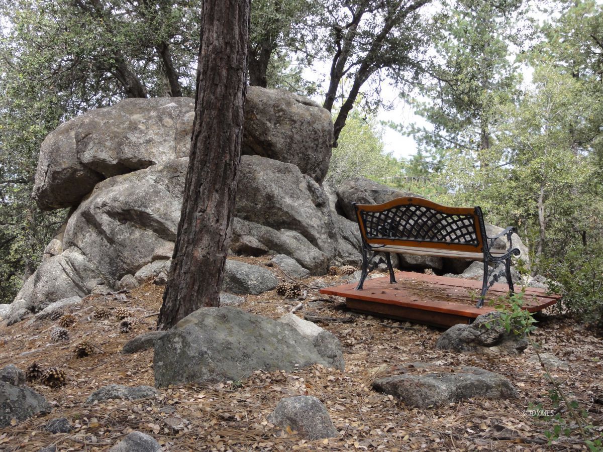 24810 Old Banning Road Idyllwild, CA 92549 - Photo 4 of 22 a view of a bench in a backyard