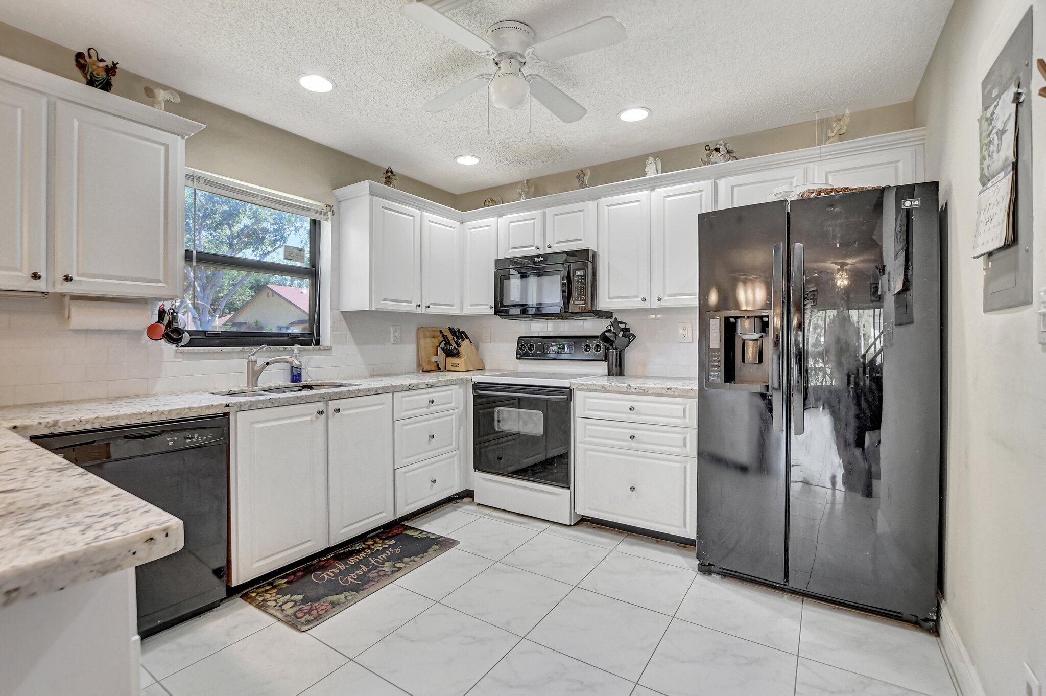 23359 Southwest 55th Way, Unit H Boca Raton, FL 33433 - Photo 13 of 41 Bright and Specious Kitchen