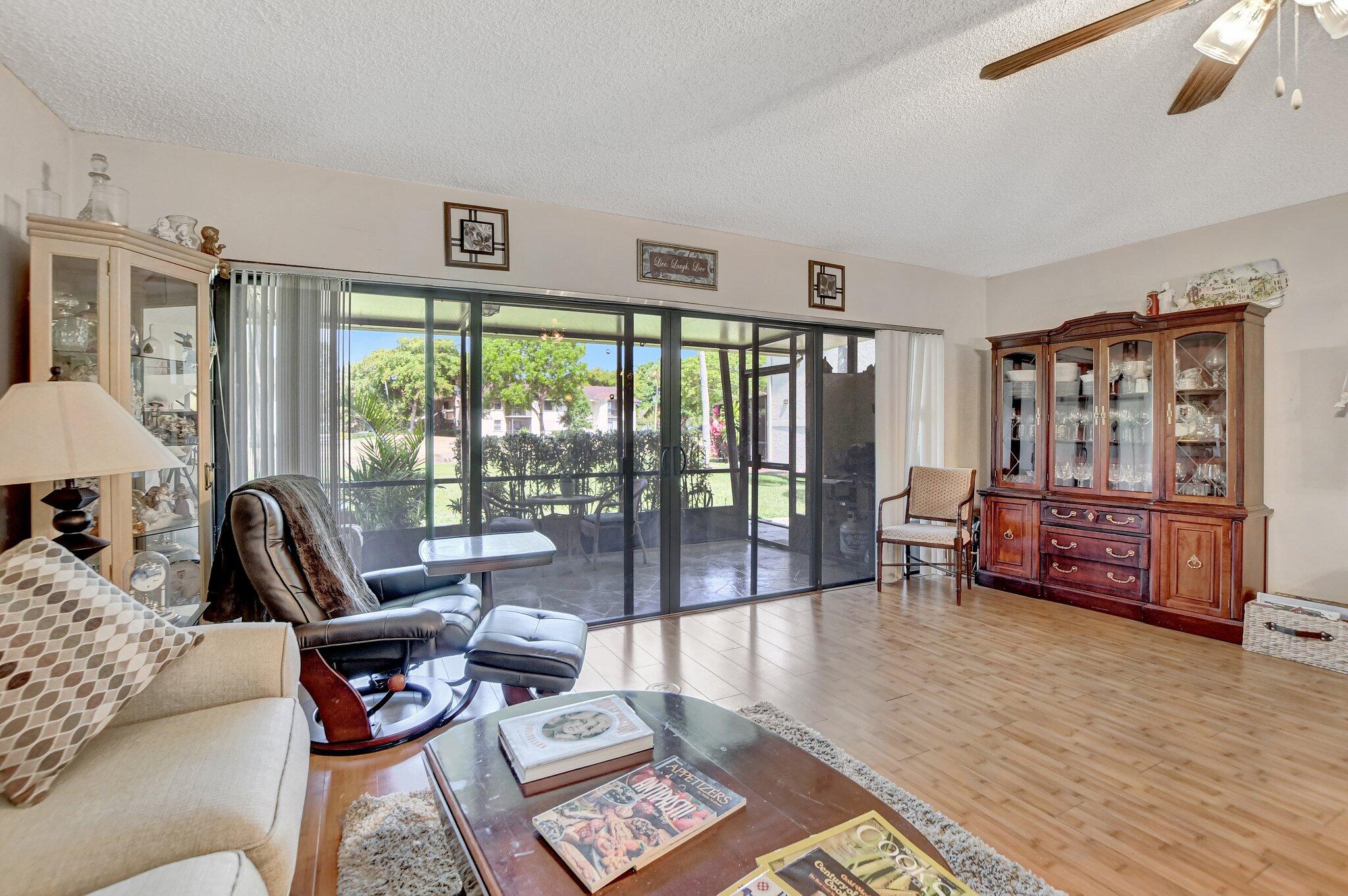 23359 Southwest 55th Way, Unit H Boca Raton, FL 33433 - Photo 16 of 41 Living room with view of patio