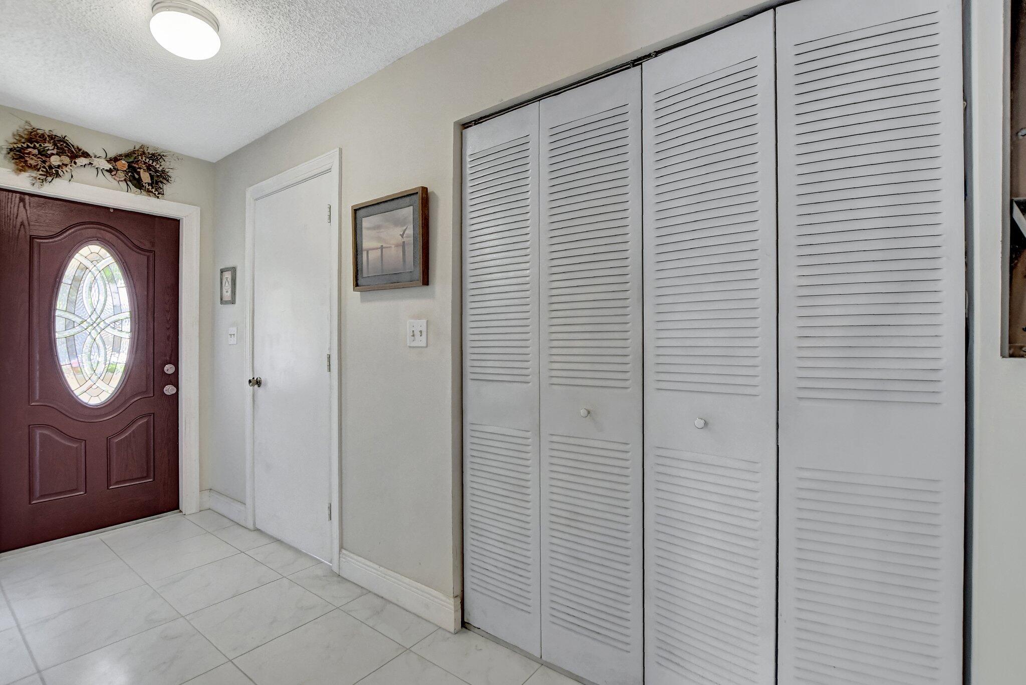23359 Southwest 55th Way, Unit H Boca Raton, FL 33433 - Photo 9 of 41 Downstairs laundry and storage - Copy