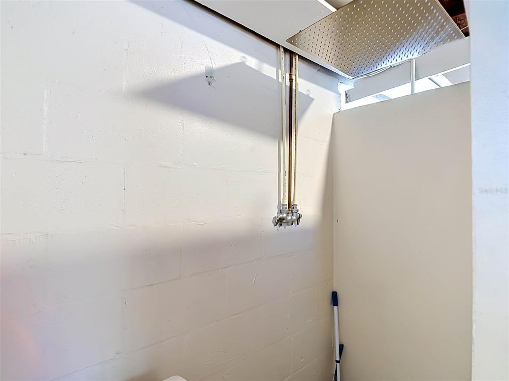 5433 Front Drive Holiday, FL 34690 - Photo 32 of 68 a bathroom with a shower and a glass door