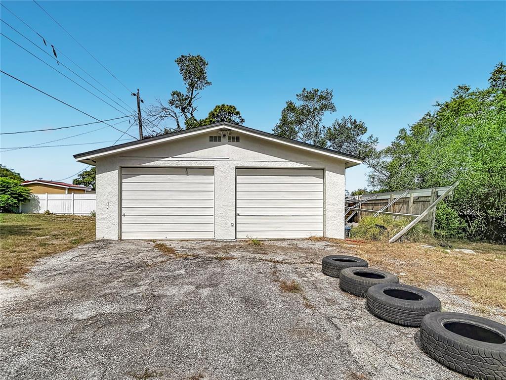 5433 Front Drive Holiday, FL 34690 - Photo 61 of 68 a view of a house with a patio