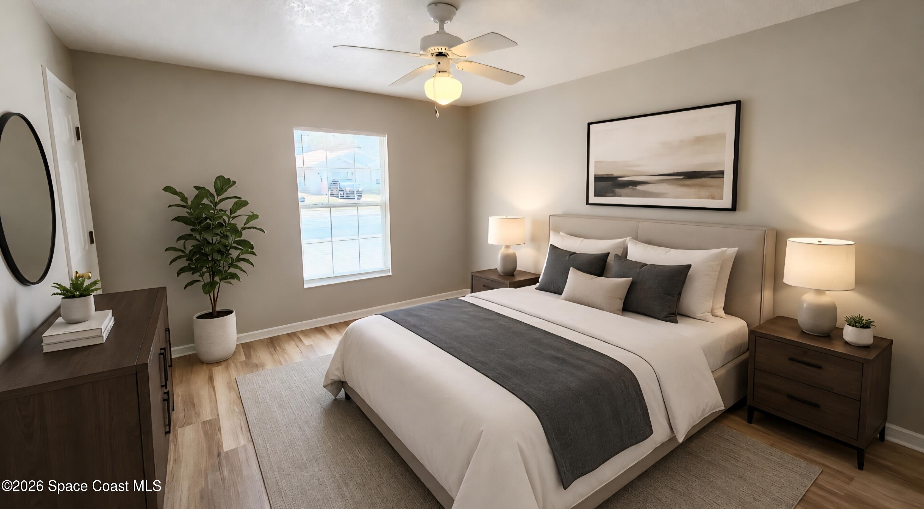 1977 Myrtle Court Palm Bay, FL 32905 - Photo 11 of 19 a bedroom with bed and a window