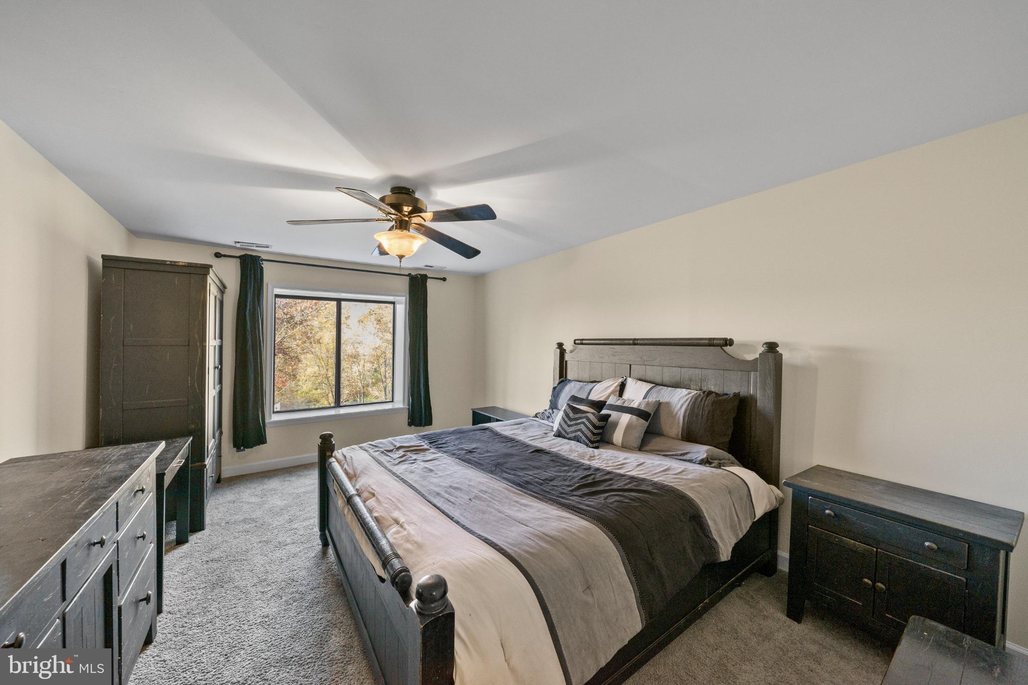 3604B Chadbury Road Mount Laurel, NJ 08054 - Photo 11 of 28 a bedroom with a bed and a chandelier