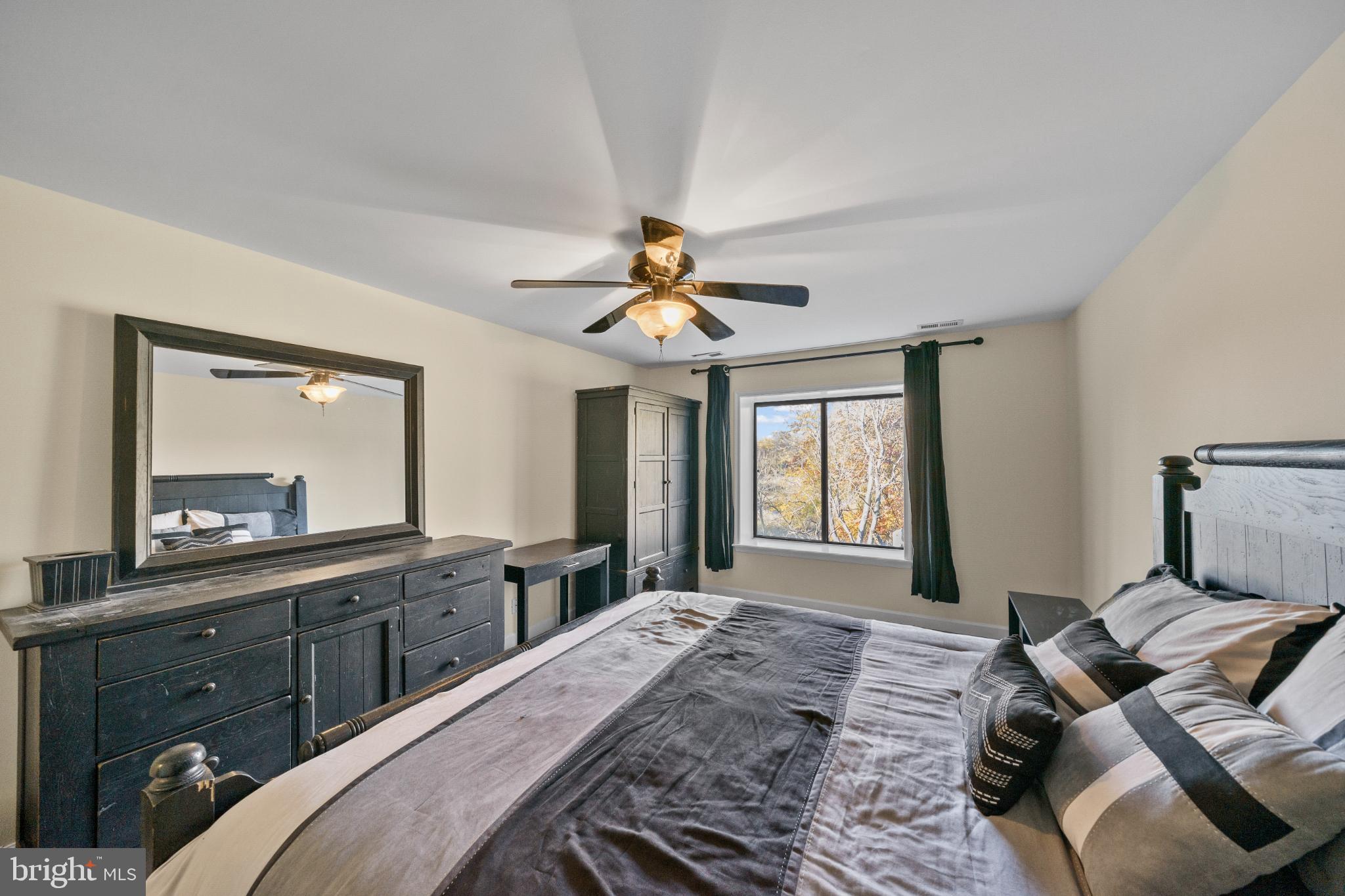 3604B Chadbury Road Mount Laurel, NJ 08054 - Photo 12 of 28 a bedroom with a large bed and a large window