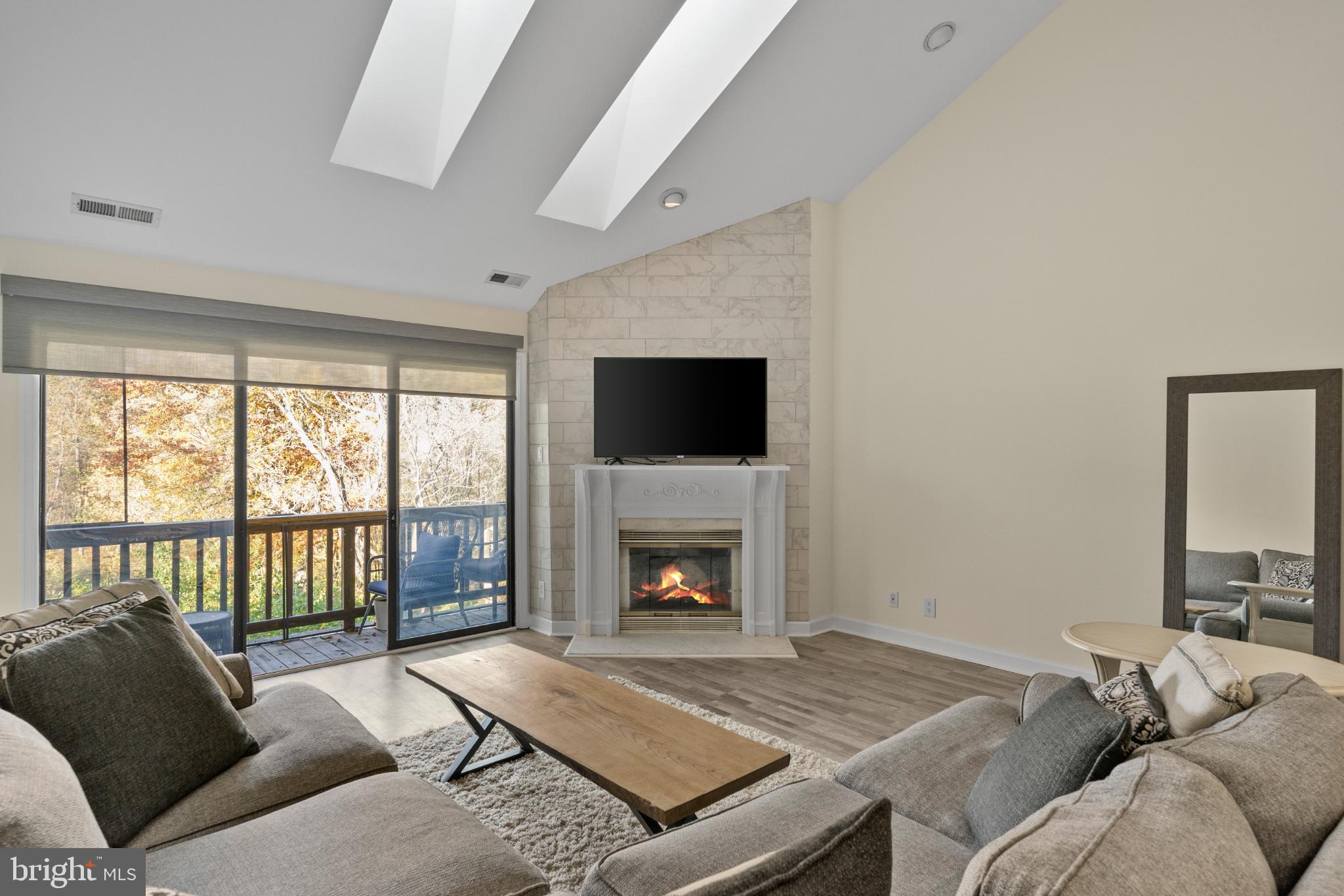 3604B Chadbury Road Mount Laurel, NJ 08054 - Photo 7 of 28 a living room with furniture and a fireplace