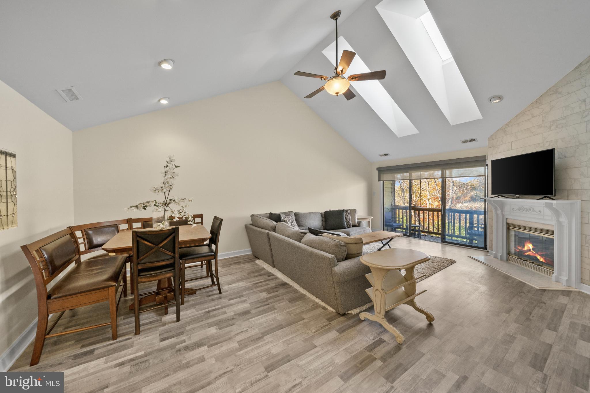 3604B Chadbury Road Mount Laurel, NJ 08054 - Photo 9 of 28 a living room with furniture a fireplace and a flat screen tv