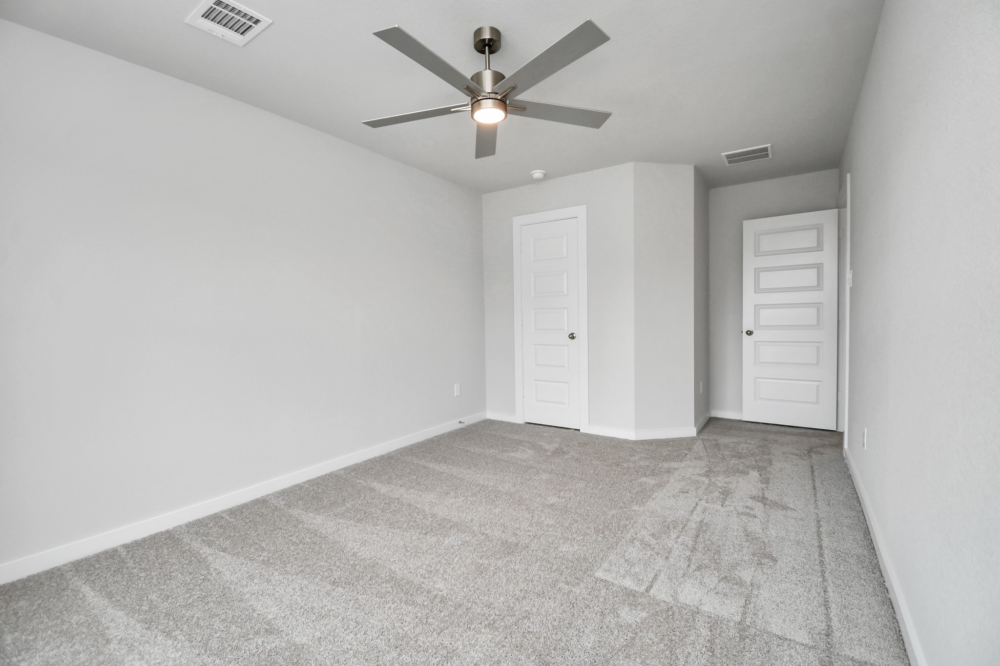 3043 Native Spg Drive Spring, TX 77373 - Photo 32 of 39 Generously sized secondary bedrooms featuring spacious closets, soft and inviting carpeting underfoot, large windows allowing plenty of natural light, and the added touch of privacy blinds for your personal retreat. Sample photo of completed home with similar floor plan. Actual colors and selections may vary.
