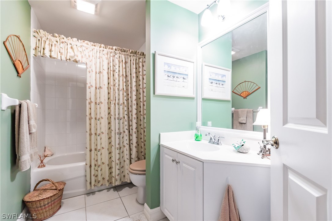 2797 First Street, Unit 403 Fort Myers, FL 33916 - Photo 11 of 33 a bathroom with a sink a toilet and shower