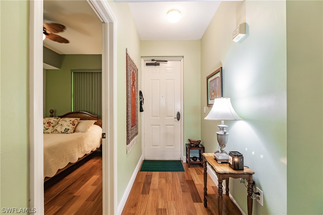 2797 First Street, Unit 403 Fort Myers, FL 33916 - Photo 12 of 33 a view of a bedroom from a hallway