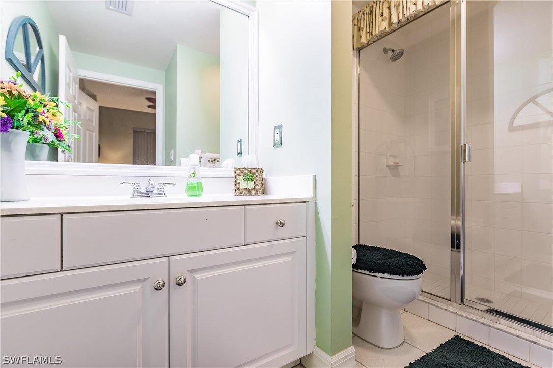 2797 First Street, Unit 403 Fort Myers, FL 33916 - Photo 14 of 33 a bathroom with a sink and a mirror