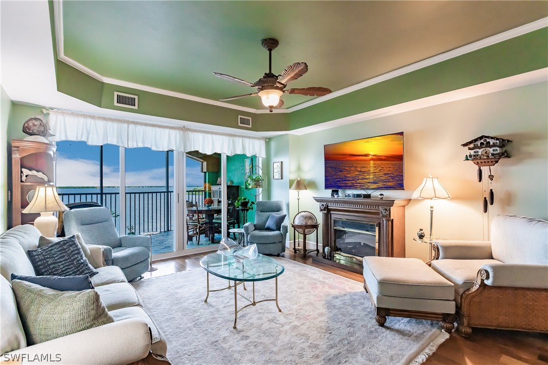 2797 First Street, Unit 403 Fort Myers, FL 33916 - Photo 15 of 33 a living room with furniture and a flat screen tv