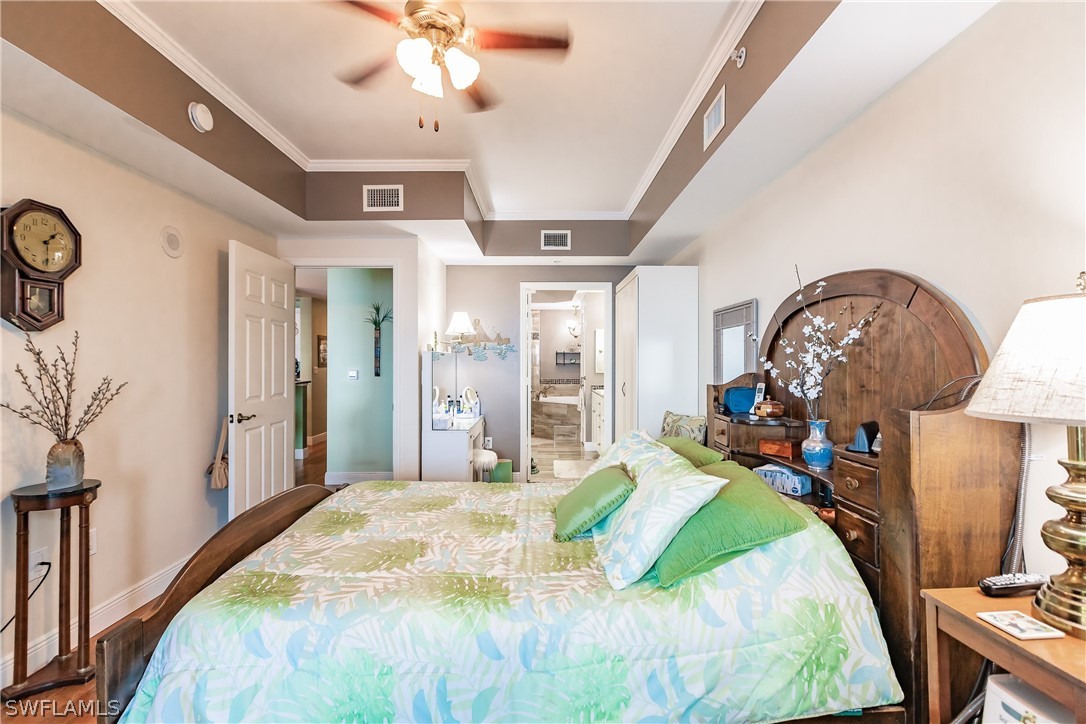 2797 First Street, Unit 403 Fort Myers, FL 33916 - Photo 20 of 33 a bed room with a bed mirror and a window