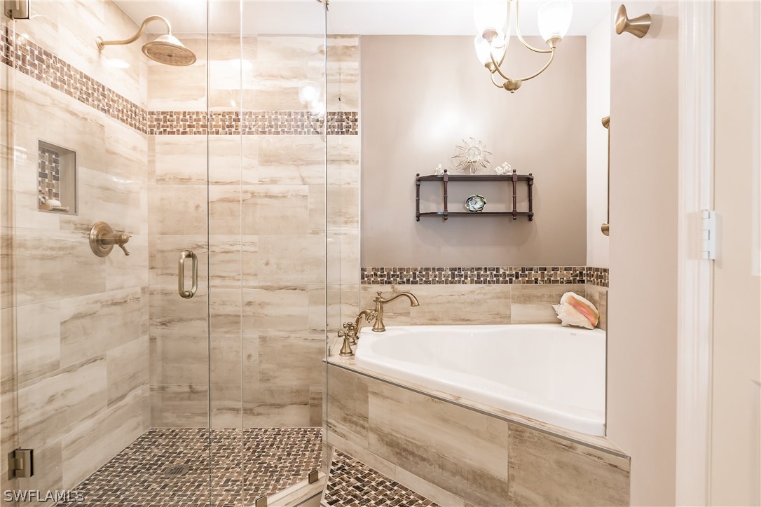 2797 First Street, Unit 403 Fort Myers, FL 33916 - Photo 21 of 33 a bathroom with a bathtub and a shower