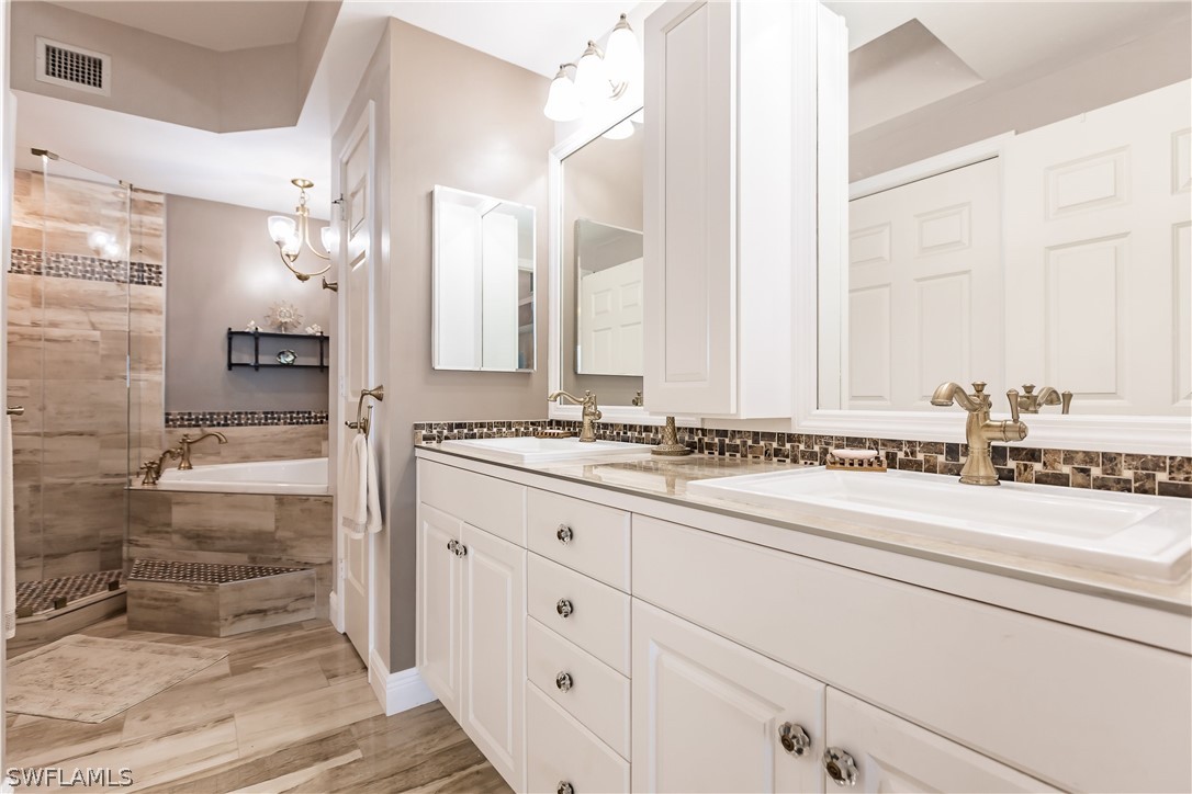 2797 First Street, Unit 403 Fort Myers, FL 33916 - Photo 24 of 33 a bathroom with a sink and a mirror