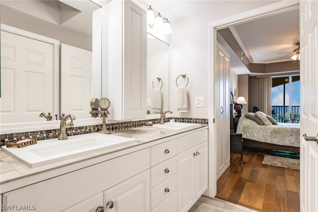 2797 First Street, Unit 403 Fort Myers, FL 33916 - Photo 25 of 33 a en suite bathroom with sinks mirror and