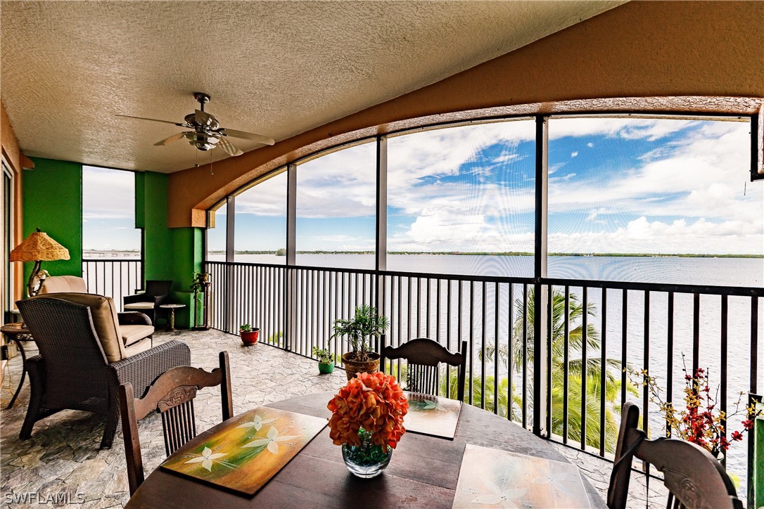 2797 First Street, Unit 403 Fort Myers, FL 33916 - Photo 26 of 33 a balcony with chairs and a potted plant