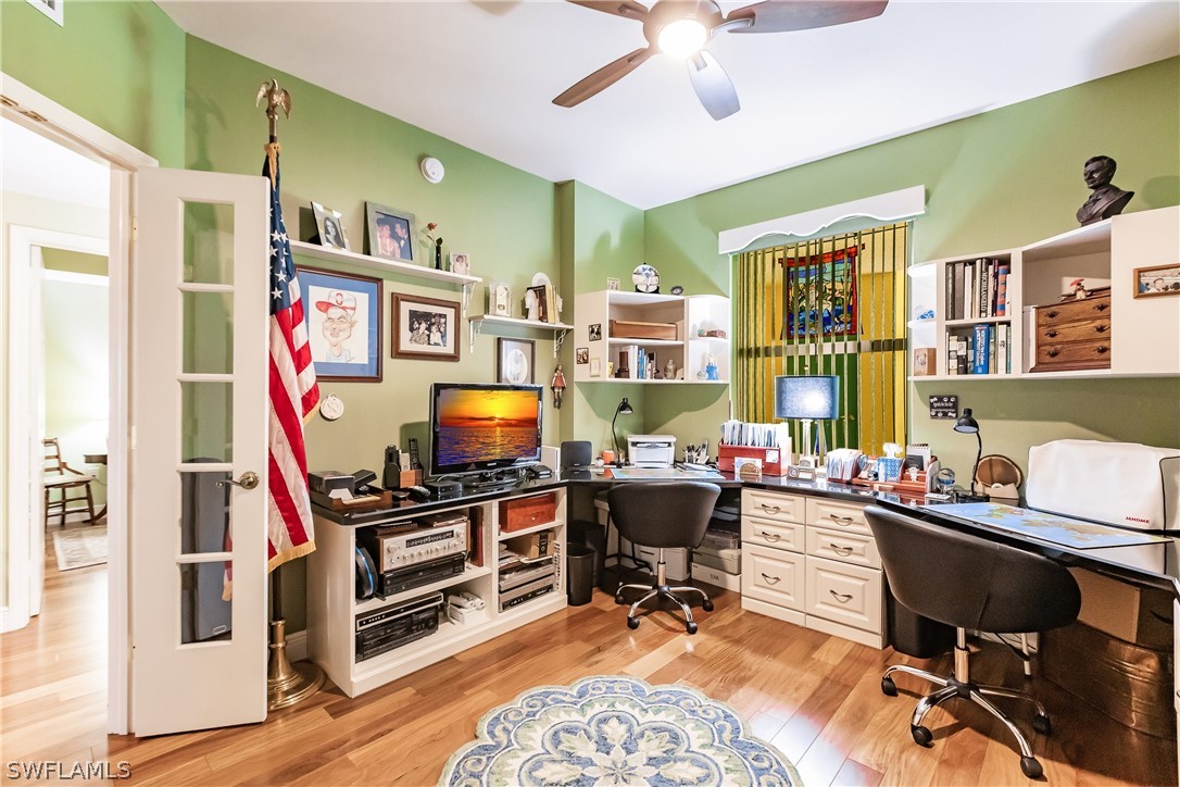 2797 First Street, Unit 403 Fort Myers, FL 33916 - Photo 9 of 33 a work room with furniture and a wooden floor