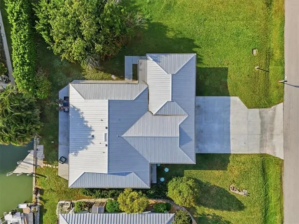 an aerial view of a house with a garden