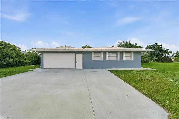 a lake view with a building in the background