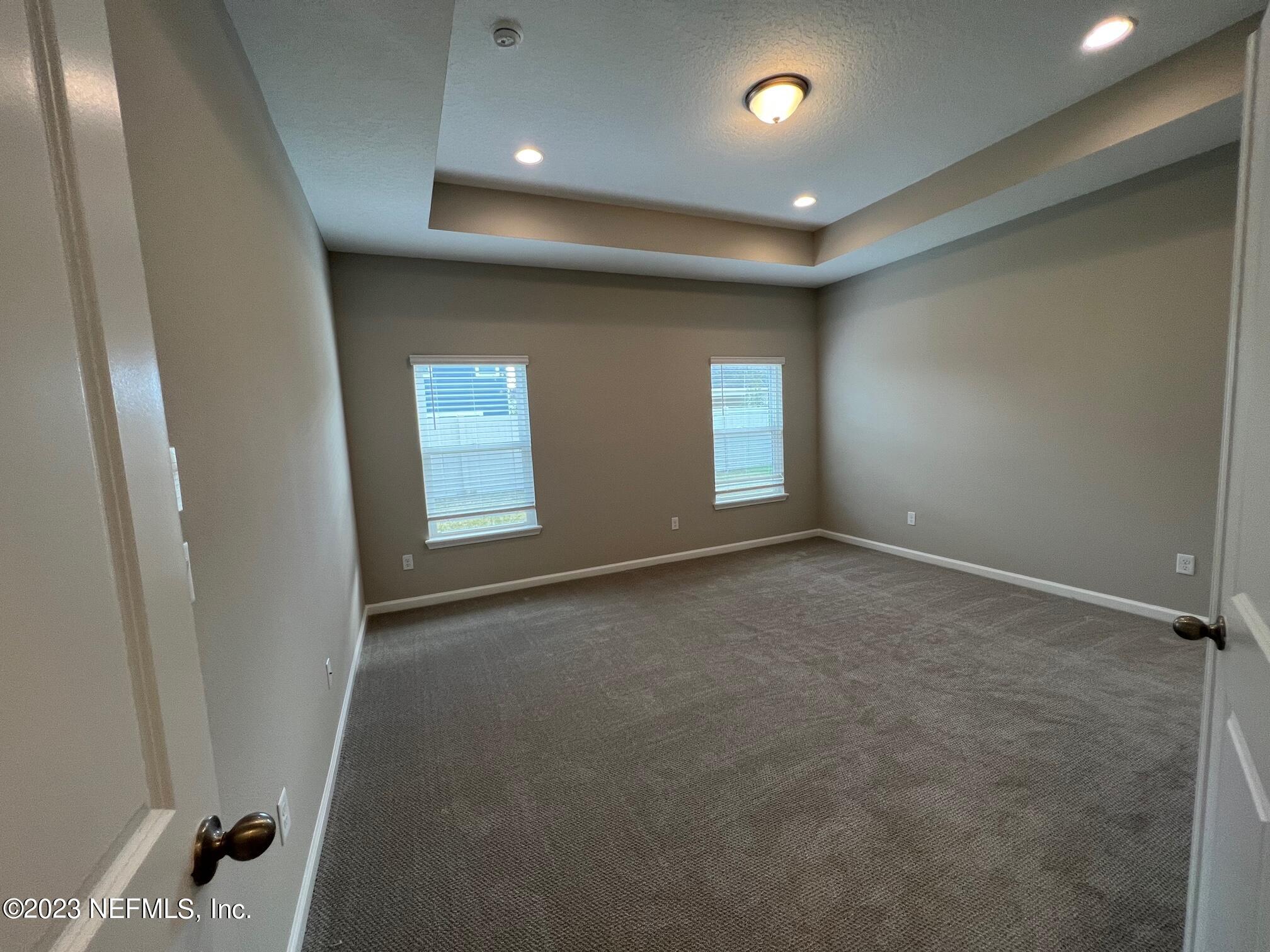 63 Yardley Ct Street St. Augustine, FL 32092 - Photo 11 of 54 an empty room with windows and closet