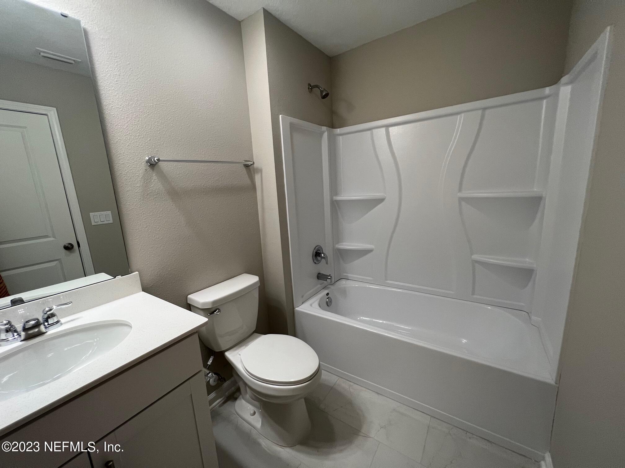 63 Yardley Ct Street St. Augustine, FL 32092 - Photo 15 of 54 a bathroom with a sink toilet and shower